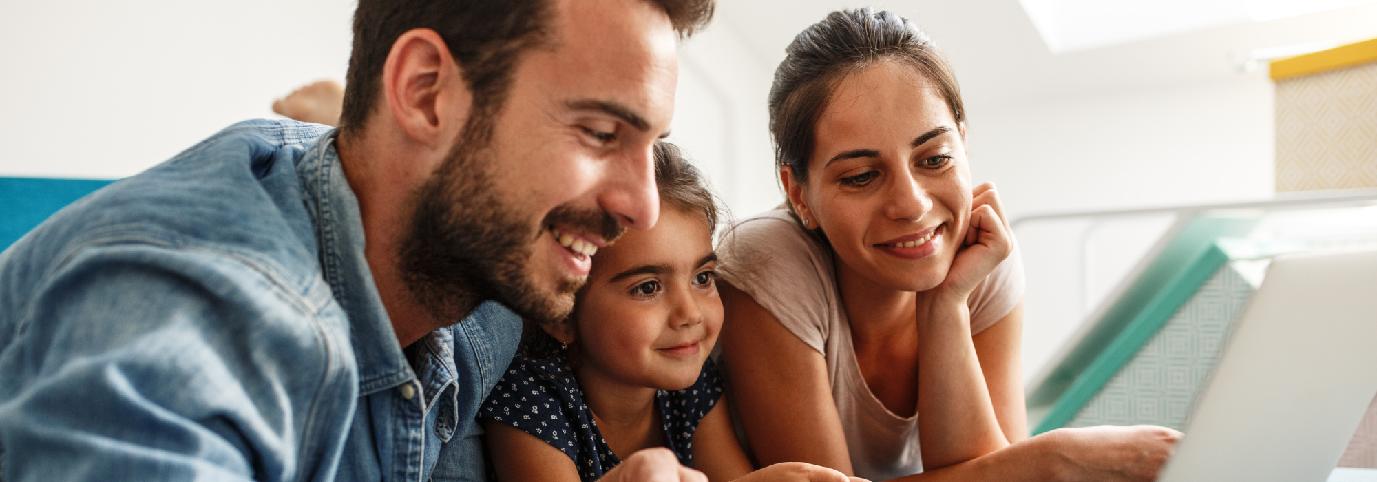 family looking at computer together